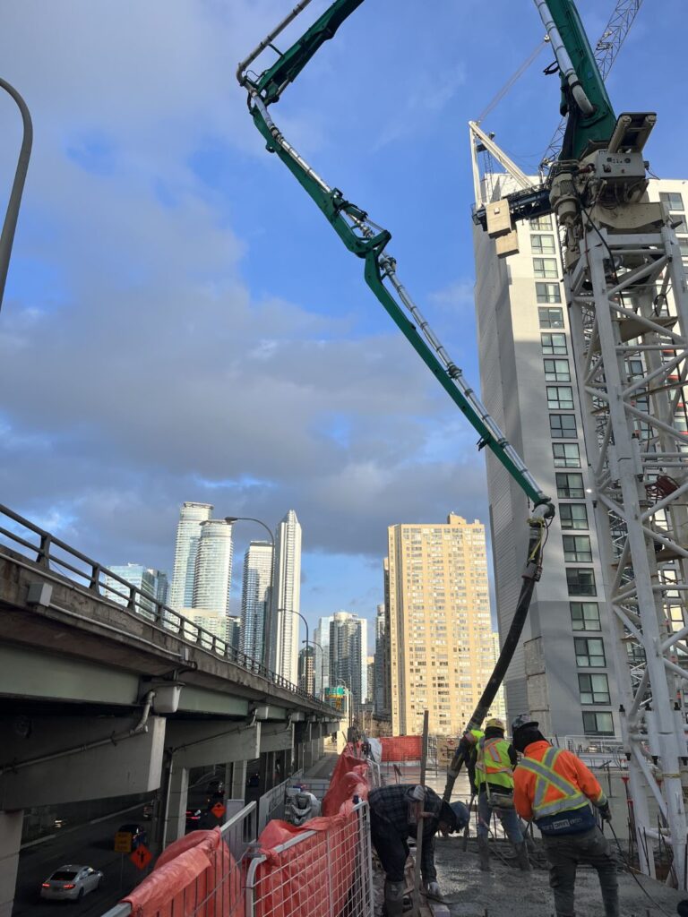 Placing boom pump on high-rise construction site - Premier Concrete Pumping Ontario
