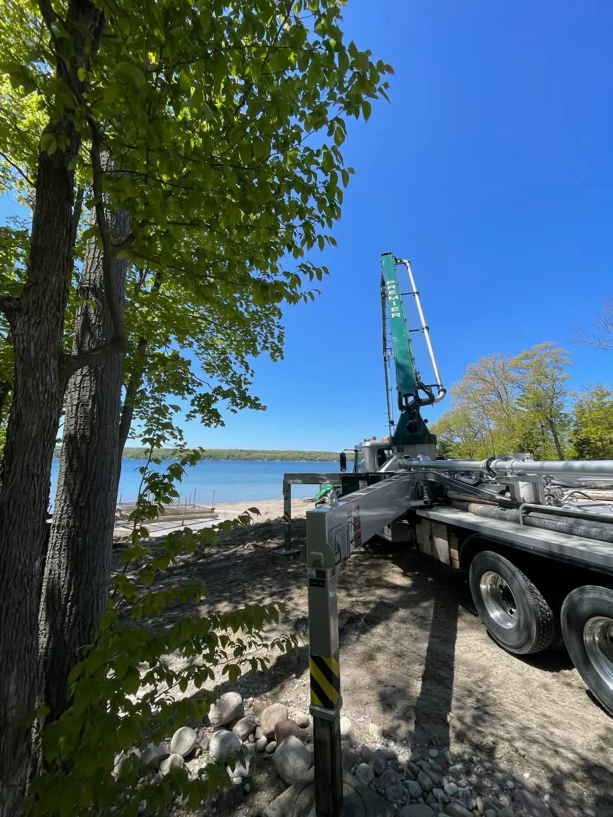 38m Putzmeister Boom Pump Foundation on the water in Ontario Canada by Premier Concrete Pumping