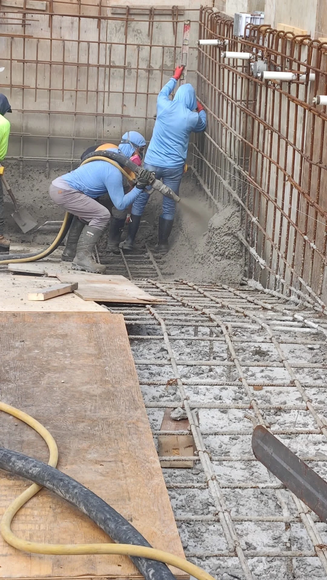 Shotcrete being applied to a pool wall