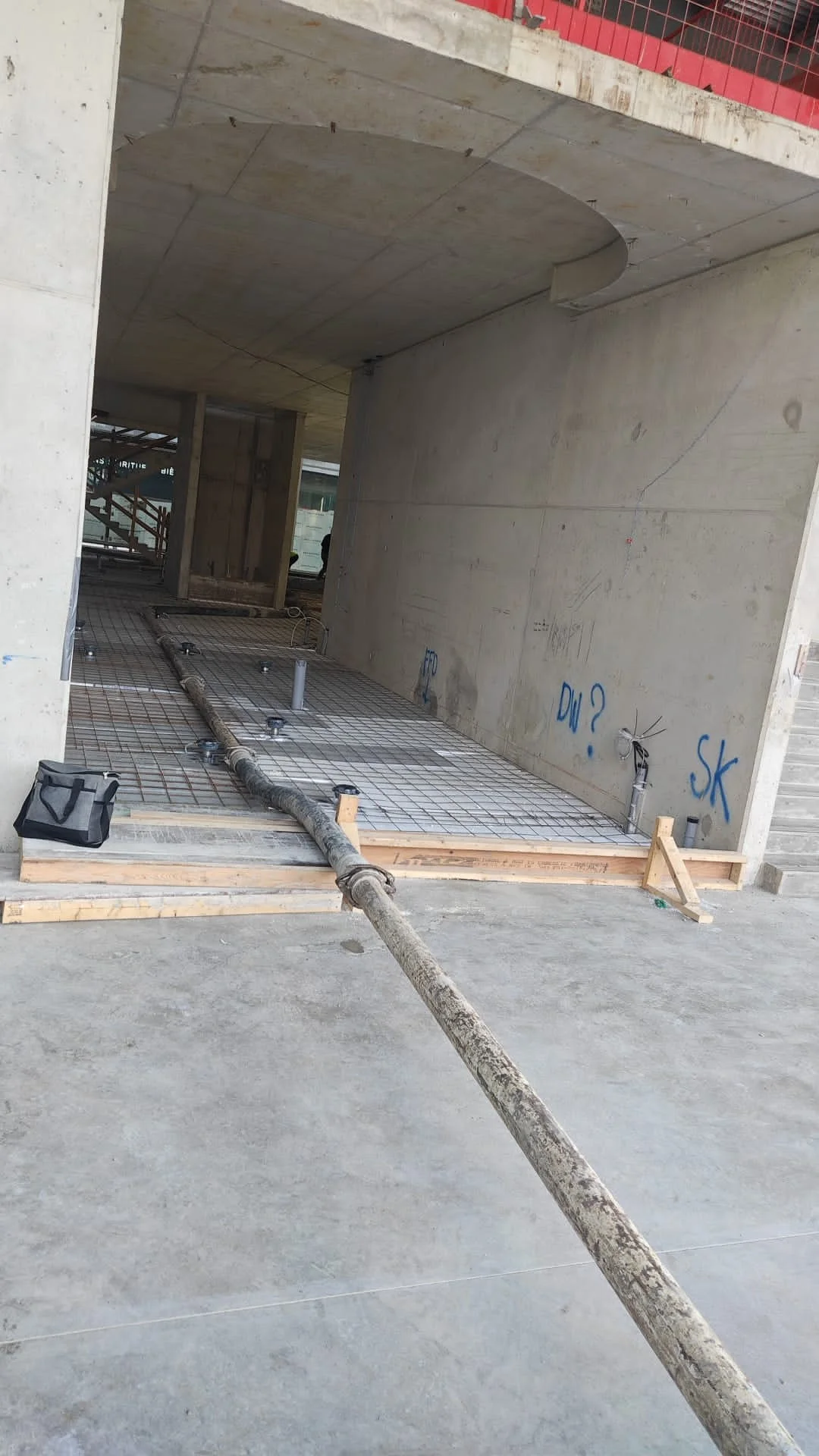 Trailer pump shows how the line is set up on ground level. Route concrete hose pump safely in Ontario