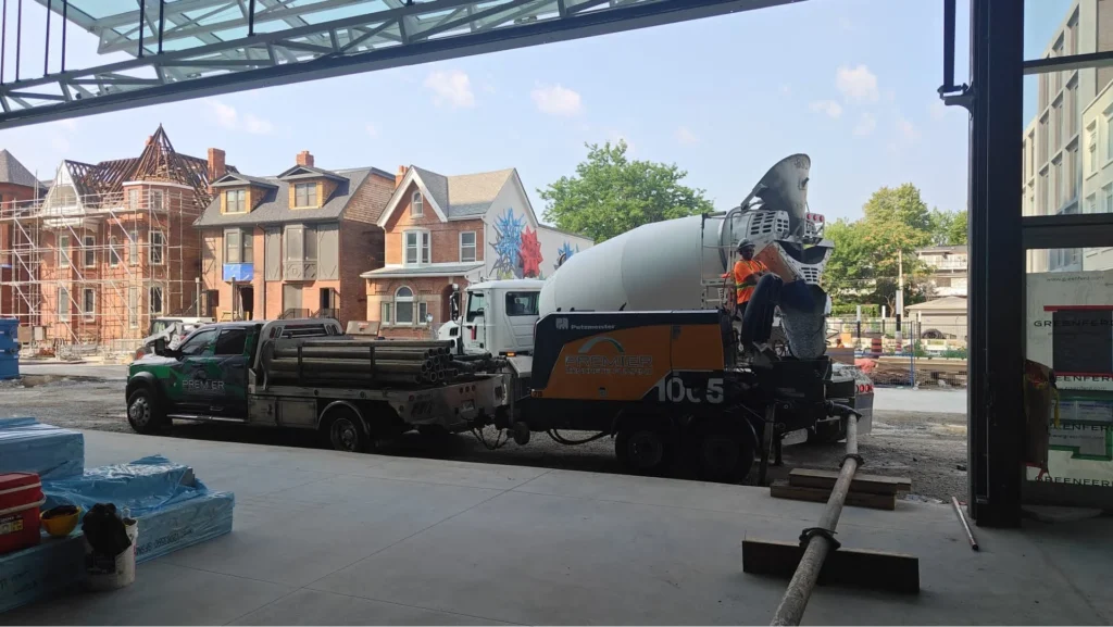 Trailer pump (tow behind) concrete being added to the hopper