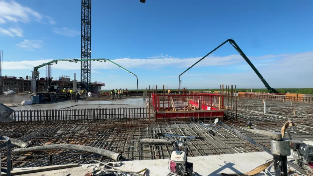 Placing boom and large boom truck pouring large slab Premier Concrete Pumping in Ontario