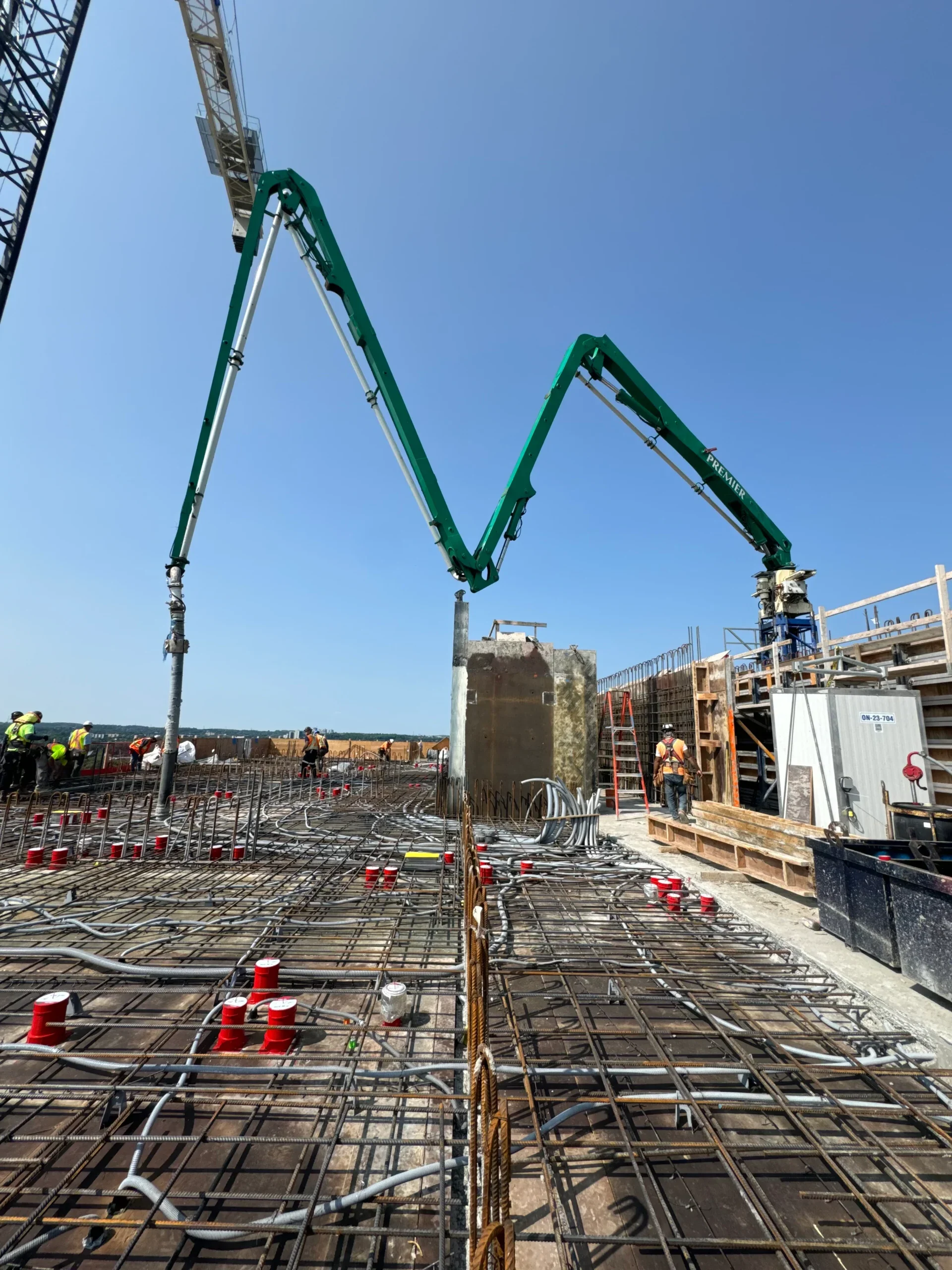 Placing boom floor pour Premier Concrete Pumping in Ontario