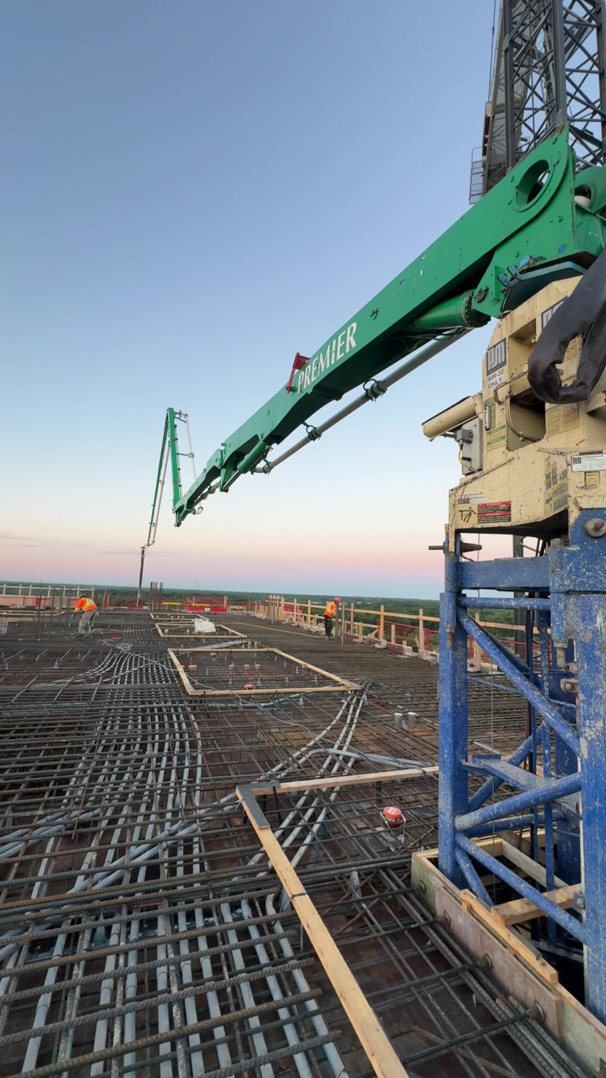 Placing boom large floor pour Premier Concrete Pumping in Ontario