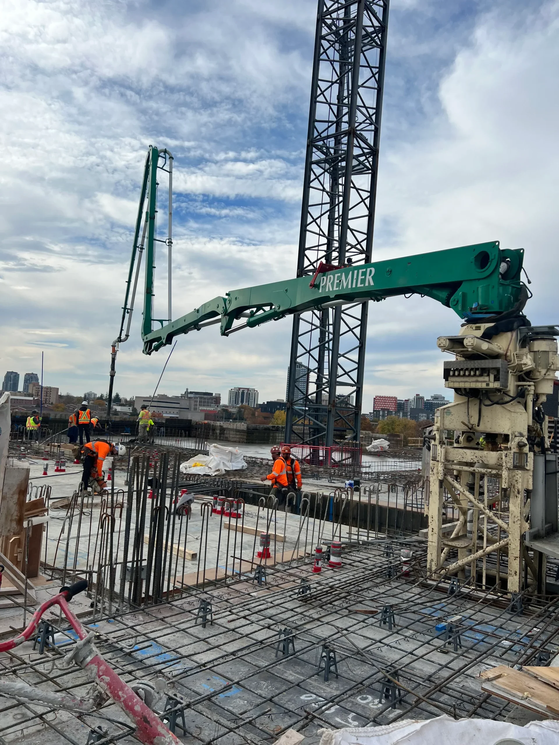 Placing boom pouring slab Premier Concrete Pumping in Ontario
